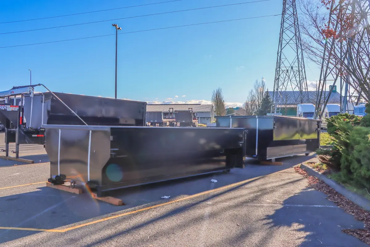 Roll-off dumpster ready for waste disposal at job site for 2 Yard Dumpster Rental in Woodstock